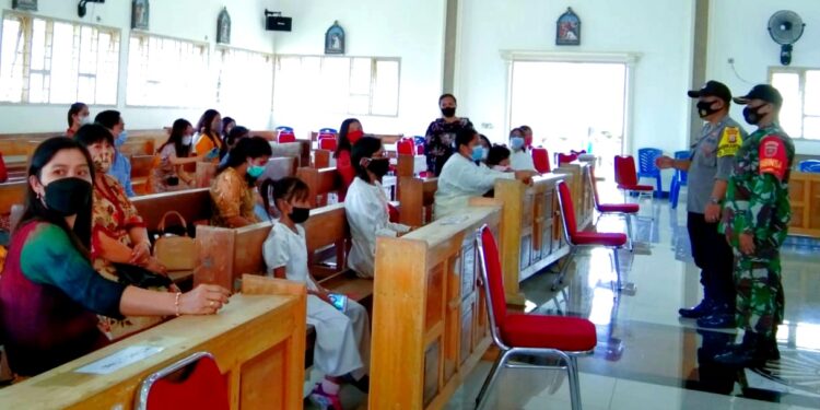 Kekompakan Babinsa dan Bhabinkamtibmas Dalam Pengamanan Perayaan Paskah